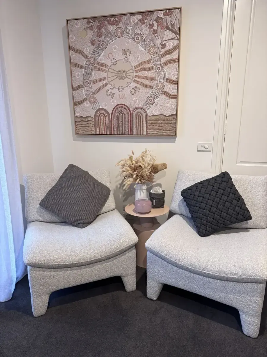 Calm counselling space with two soft chairs in Malvern, Victoria
